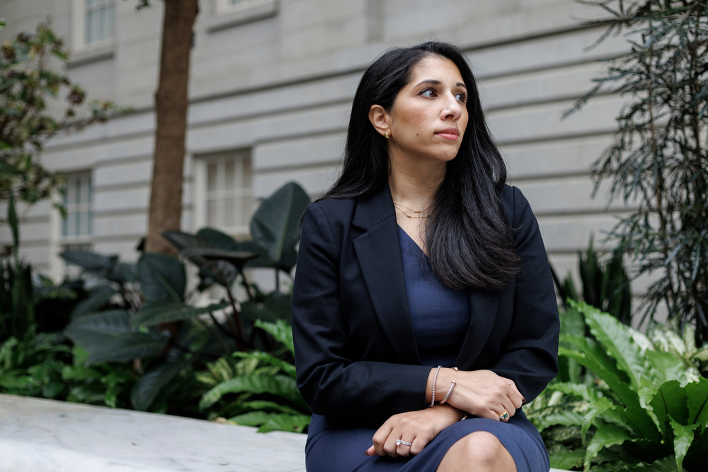 Anam Petit, a former Justice Department employee, poses for a portrait in the Robert and Arlene Kogod Courtyard at the National Portrait Gallery in Washington, Friday, Jan. 9, 2026. (AP Photo/Moriah Ratner)