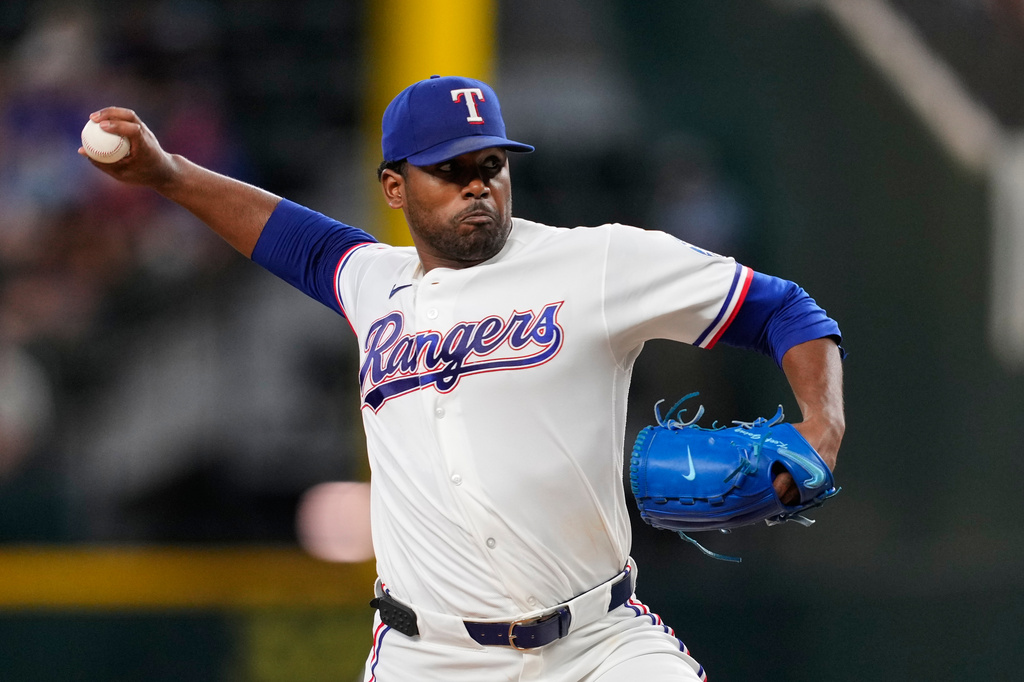 Texas Rangers pitcher Kumar Rocker throws to the Seattle Mariners in the first inning of a baseball game in Arlington, Texas, Monday, July 27, 2026. (AP Photo/Tony Gutierrez)