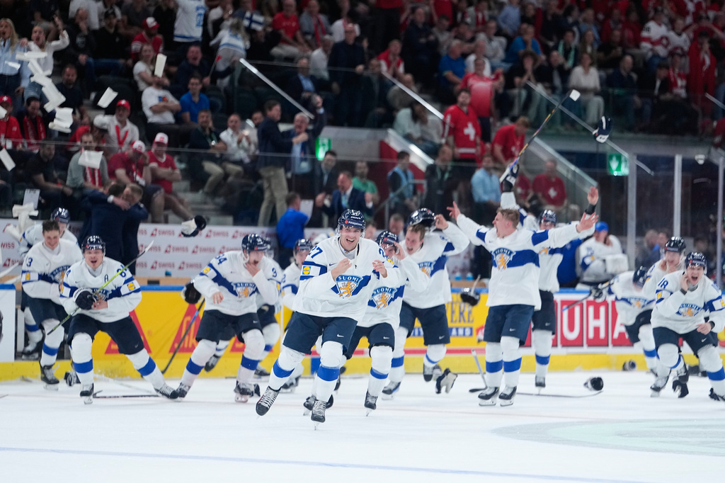 Finland players celebrate after winning the gold medal during a 2026 IIHF Men's Ice Hockey World Championship final match between Switzerland and Finland, in Zurich, Switzerland, Sunday, May 31, 2026. (AP Photo/Darko Bandic)