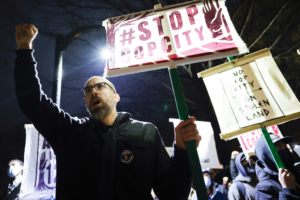 FILE - Andrew Douglas, of Atlanta, raises his fist during a protest over plans to build a police training center, March 9, 2023, in Atlanta. (AP Photo/Alex Slitz, file)