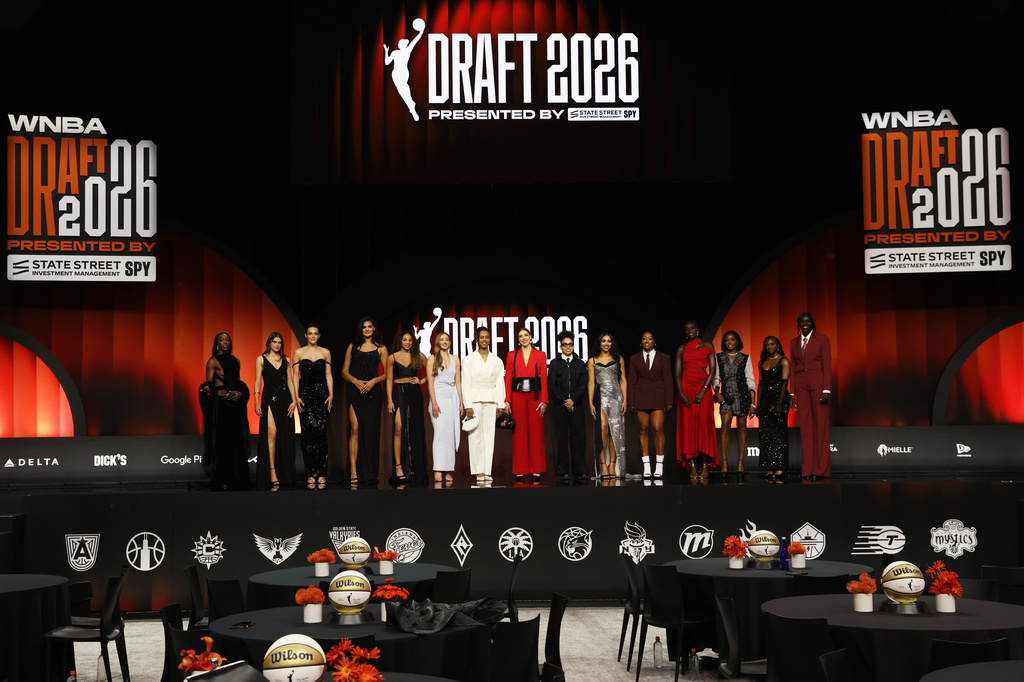 WNBA prospects pose on stage before the WNBA basketball draft Monday, April 13, 2026, in New York. (AP Photo/Pamela Smith)