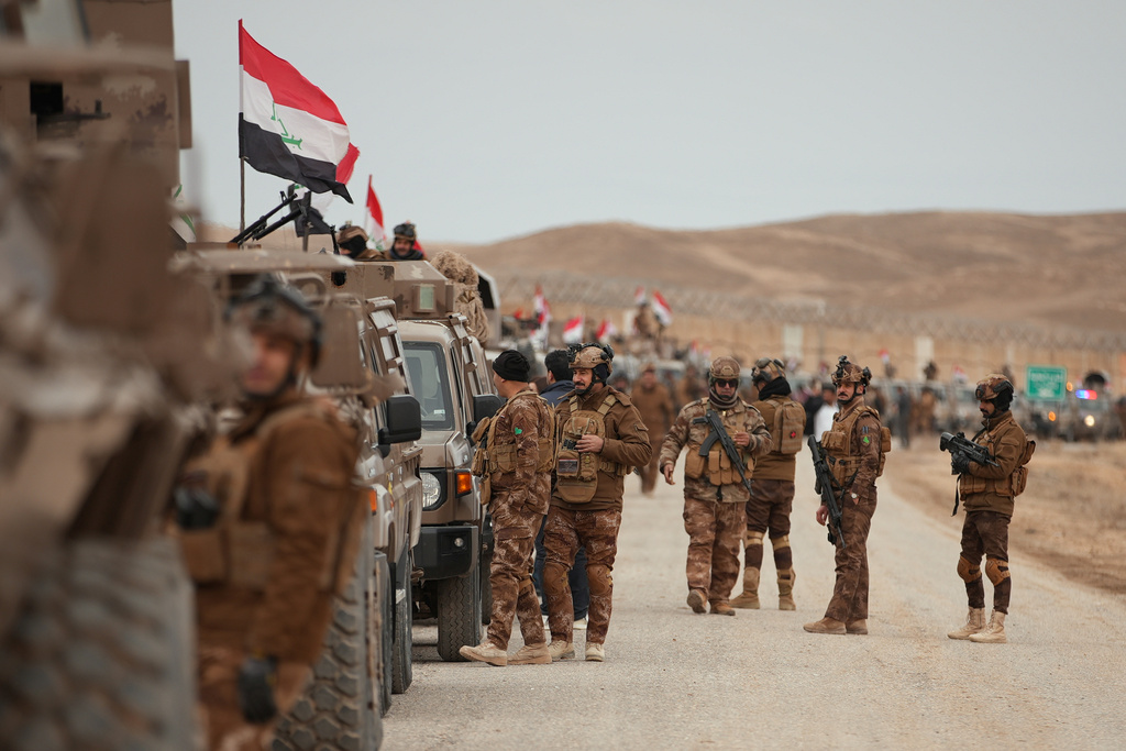 Iraqi Border Guards patrol along the border with Syria, in Sinjar, northern Iraq, Thursday, Jan. 22, 2026. (AP Photo/Farid Abdulwahed)