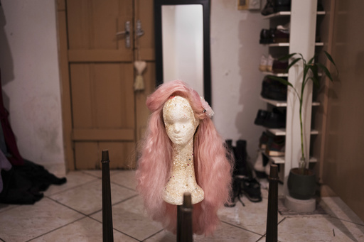 A pink colored wig belonging to Nelson Viveros sits on a foam head at his home in Asuncion, Paraguay, Friday, Sept. 12, 2025. (AP Photo/Jorge Saenz) A pink colored wig belonging to Nelson Viveros sits on a foam head at his home in Asuncion, Paraguay, Friday, Sept. 12, 2025. (AP Photo/Jorge Saenz)