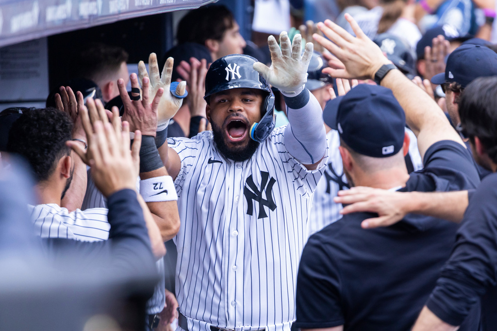 New York Yankees' Heliot Ramos celebrates in the dugout after hitting a three-run home run in the fifth inning during a baseball game against the Boston Red Sox, Sunday, Aug. 30, 2026, in New York. (AP Photo/Corey Sipkin)