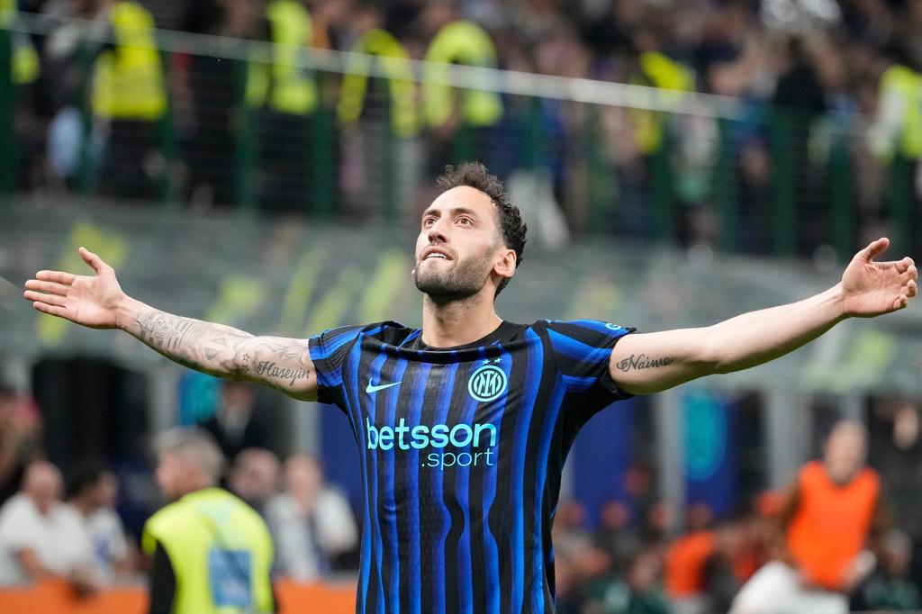 Inter Milan's Hakan Calhanoglu celebrates after scoring his side's second goal during the Serie A soccer match between Inter Milan and Roma in Milan, Italy, Sunday, April 5, 2026. (AP Photo/Luca Bruno)