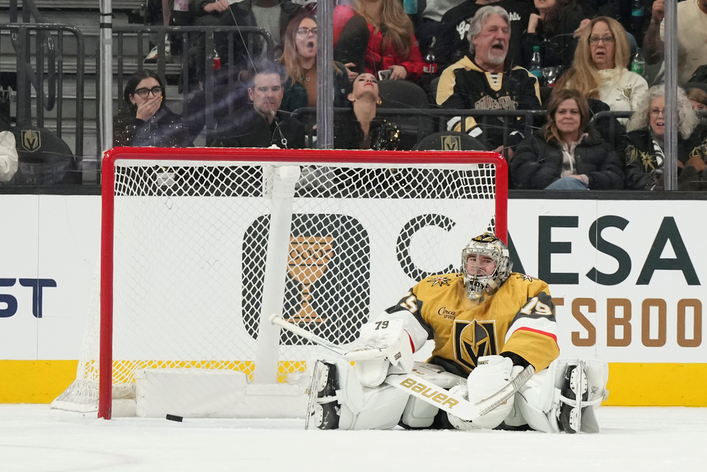 Vegas Golden Knights goaltender Carter Hart reacts to being scored on by Colorado Avalanche center Martin Necas (88) during the second period of an NHL hockey game, Saturday, Dec. 27, 2025, in Las Vegas. (AP Photo/Candice Ward)