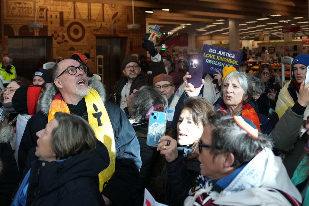 Protesters gather at Target, Friday, Jan. 23, 2026, in Minneapolis. (AP Photo/Abbie Parr)