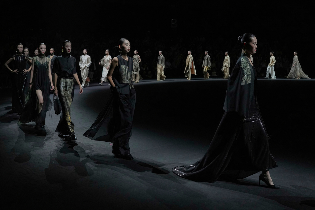 Models wear creations "Only This Chartreuse" by Wan Yue and Li Luyi during the SS2026 China Fashion Week in Beijing, Sunday, Sept. 7, 2025. (AP Photo/Andy Wong)