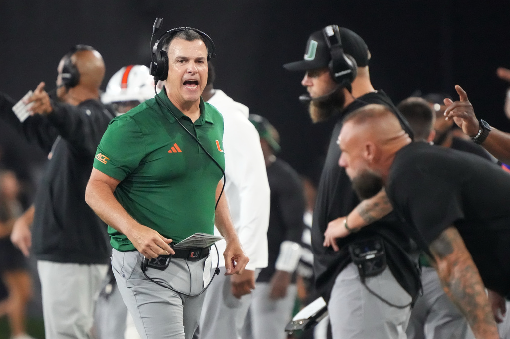 Miami head coach Mario Cristobal argues a call during the second half of an NCAA college football game against Wake Forest in Winston-Salem, N.C., Friday, Sept. 18, 2026. (AP Photo/Chuck Burton)