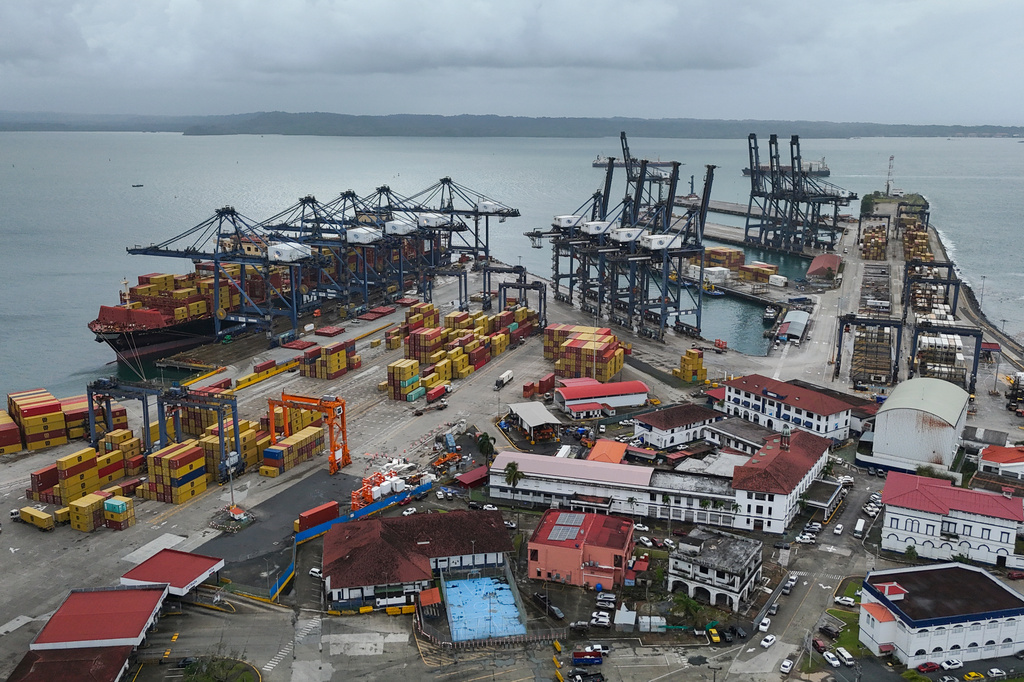 FILE - Cranes load and unload containers from cargo ships at the Cristobal port, operated by the Panama Ports Company, in Colon, Panama, Feb. 6, 2026. (AP Photo/Matias Delacroix, File)