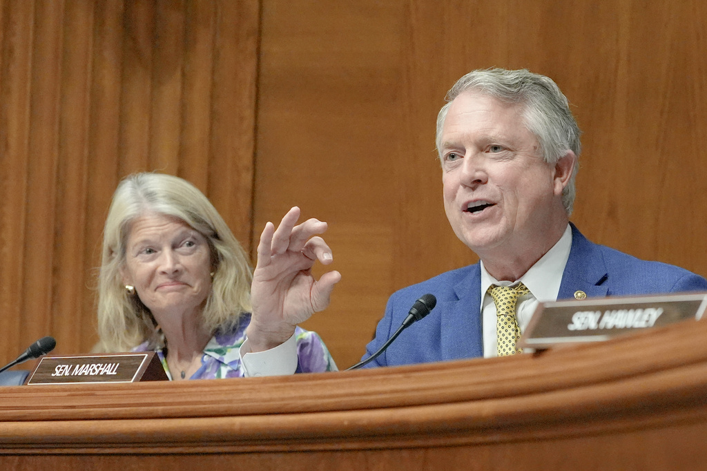 Sen. Roger Marshall, R-Kan., asks a question as Sen. Lisa Murkowski, R-Alaska, reacts during a Senate Health Education Labor and Pension committee confirmation hearing for Keith Sonderling to be Labor Secretary, on Capitol Hill, Thursday, July 16, 2026, in Washington. (AP Photo/Mariam Zuhaib)