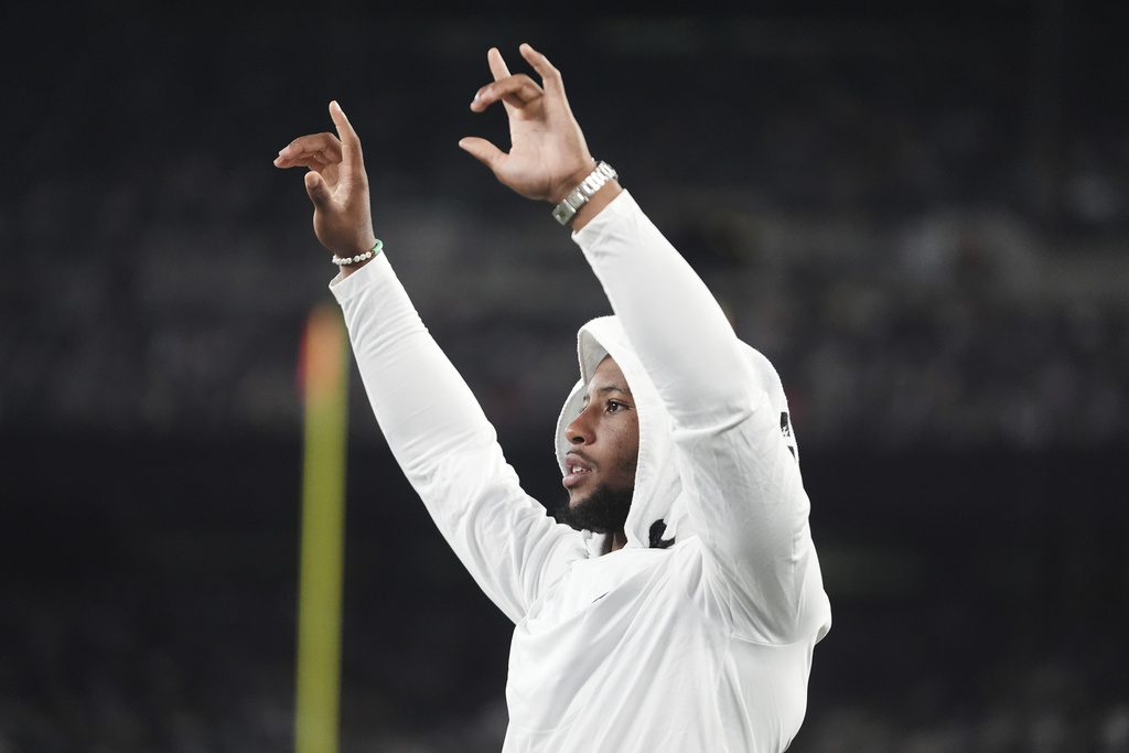 Philadelphia Eagles running back Saquon Barkley reacts in the second half of a preseason NFL football game against the New York Jets in East Rutherford, N.J., Friday, Aug. 22, 2025. (AP Photo/Frank Franklin)