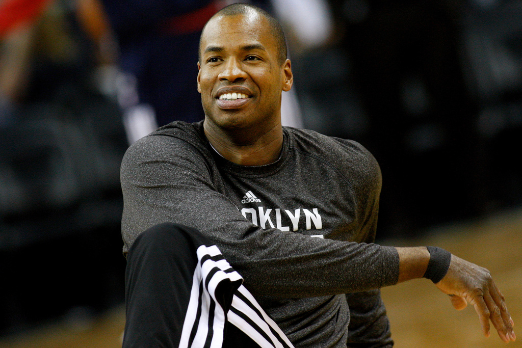 FILE - Brooklyn Nets center Jason Collins (98) warms up before an NBA basketball game in New Orleans, Monday, March 24, 2014. (AP Photo/Jonathan Bachman, File)