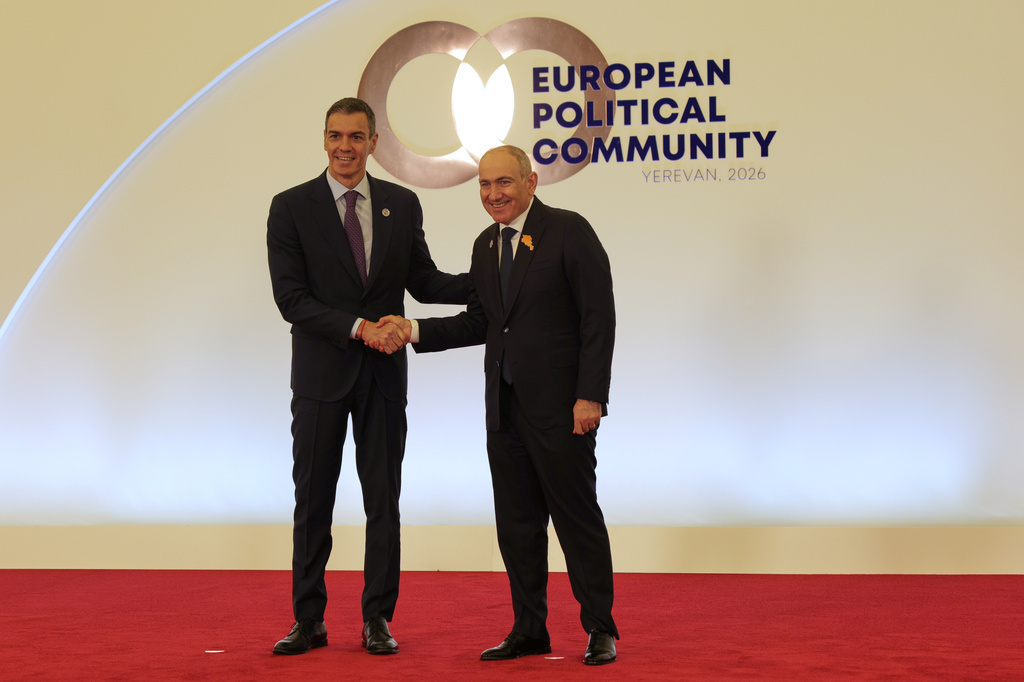 Spain's Prime Minister Pedro Sanchez, left, shakes hands with Armenia's Prime Minister Nikol Pashinyan as he arrives for a meeting of the European Political Community in Yerevan, Armenia, Monday, May 4, 2026. (AP Photo/Anthony Pizzoferrato)