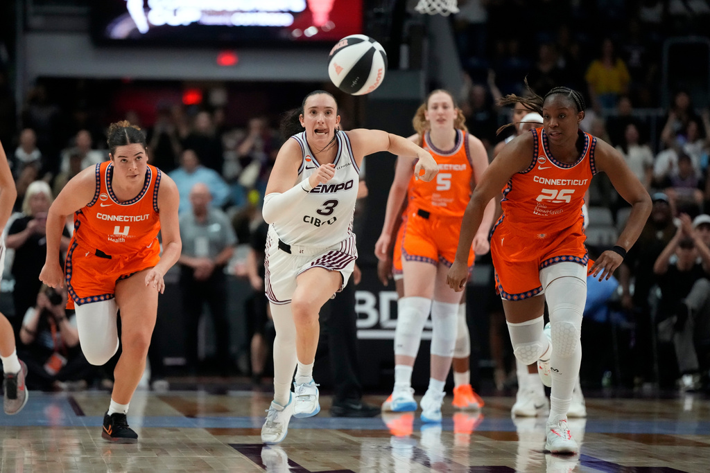 Toronto Tempo's Marina Mabrey (3) chases down the loose ball in the final seconds for the Tempo win against the Connecticut Sun during the second half of a WNBA game in Toronto, Wednesday, June 10, 2026. (Frank Gunn/The Canadian Press via AP)
