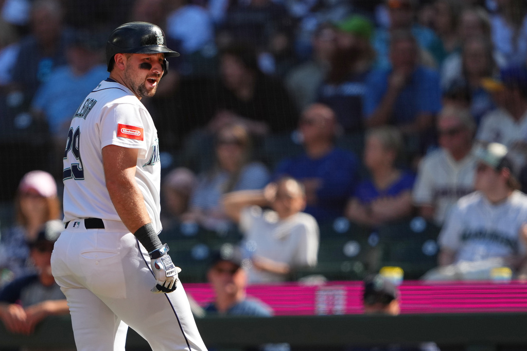 Seattle Mariners designated hitter Cal Raleigh reacts after losing a challenge and being called out on strikes during the seventh inning of a baseball game against the Philadelphia Phillies, Wednesday, Aug. 26, 2026, in Seattle. (AP Photo/Lindsey Wasson)