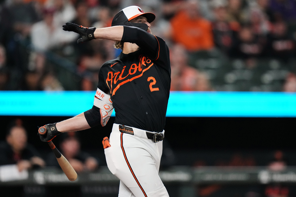 Baltimore Orioles' Gunnar Henderson follows through on a home run during the third inning of a baseball game against the San Francisco Giants, Saturday, April 11, 2026, in Baltimore. (AP Photo/Stephanie Scarbrough)