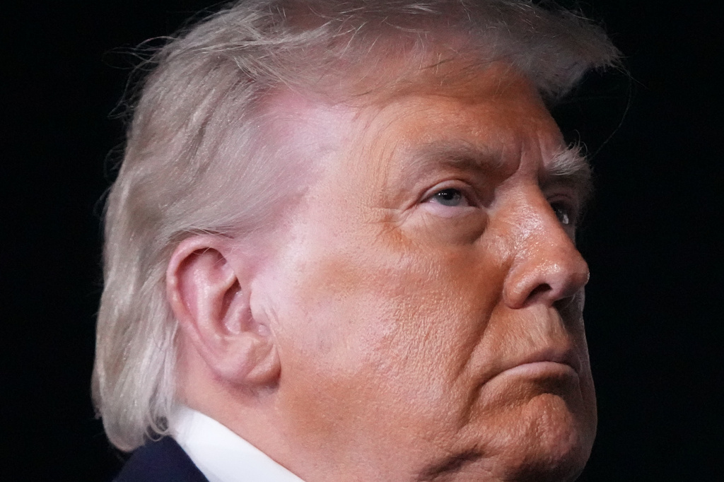 President Donald Trump talks with reporters before boarding Air Force One at John F. Kennedy International Airport in New York, early Tuesday, June 9, 2026. (AP Photo/Mark Schiefelbein)