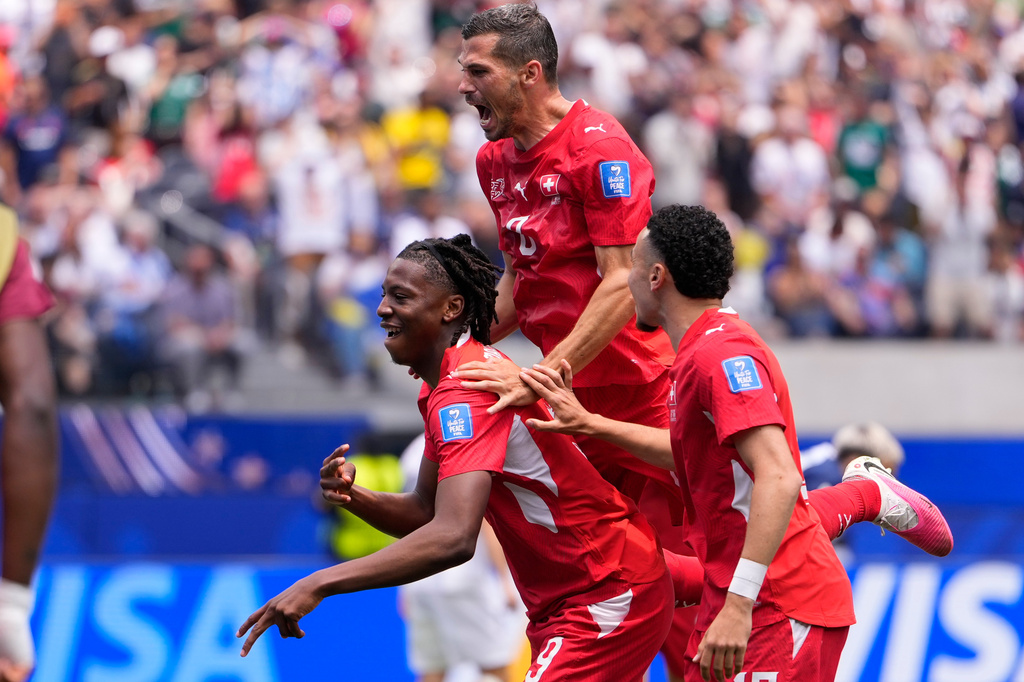 Switzerland's Johan Manzambi, left, celebrates with teammates after scoring the opening goal against Bosnia during the World Cup Group B soccer match in Inglewood, Calif., near Los Angeles, Thursday, June 18, 2026. (AP Photo/Mark J. Terrill)