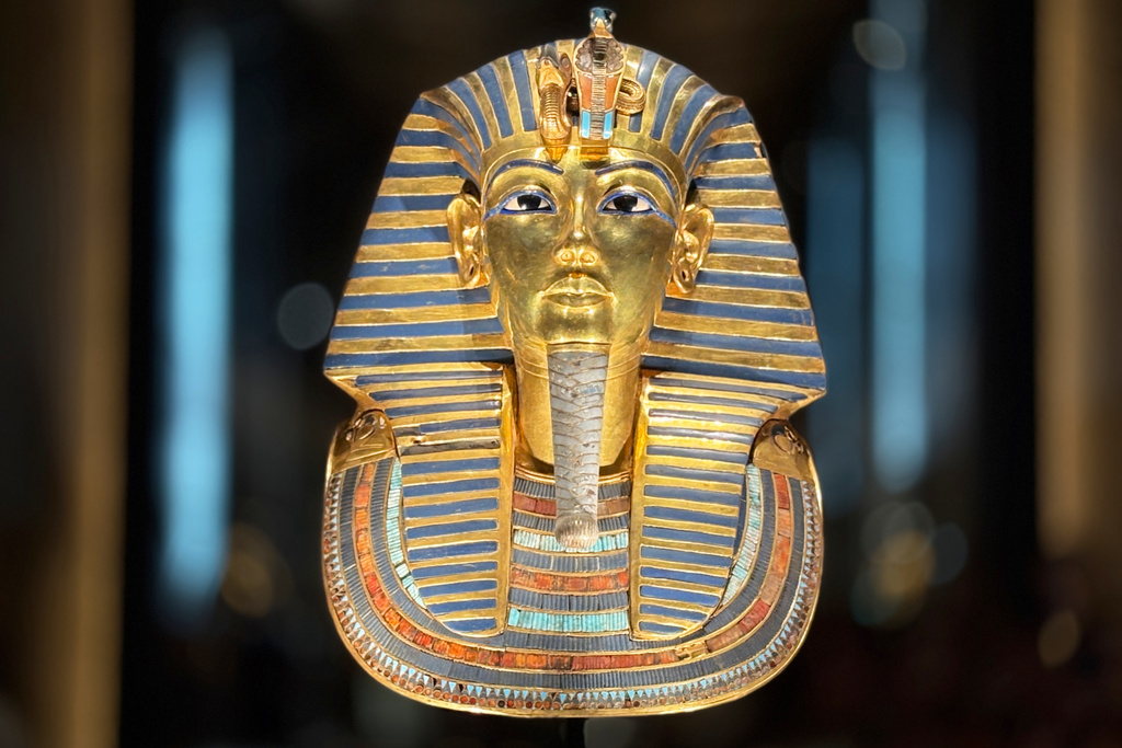 The golden burial mask of King Tutankhamun is displayed during the first day for visitors after the official opening of the Grand Egyptian Museum in Giza, Egypt, Tuesday, Nov. 4, 2025. (AP Photo/Amr Nabil)