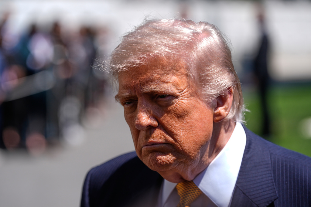 President Donald Trump speaks to reporters as he leaves the White House for travel to Beijing, Tuesday, May 12, 2026, in Washington, to meet with China's President Xi Jinping. (AP Photo/Manuel Balce Ceneta)