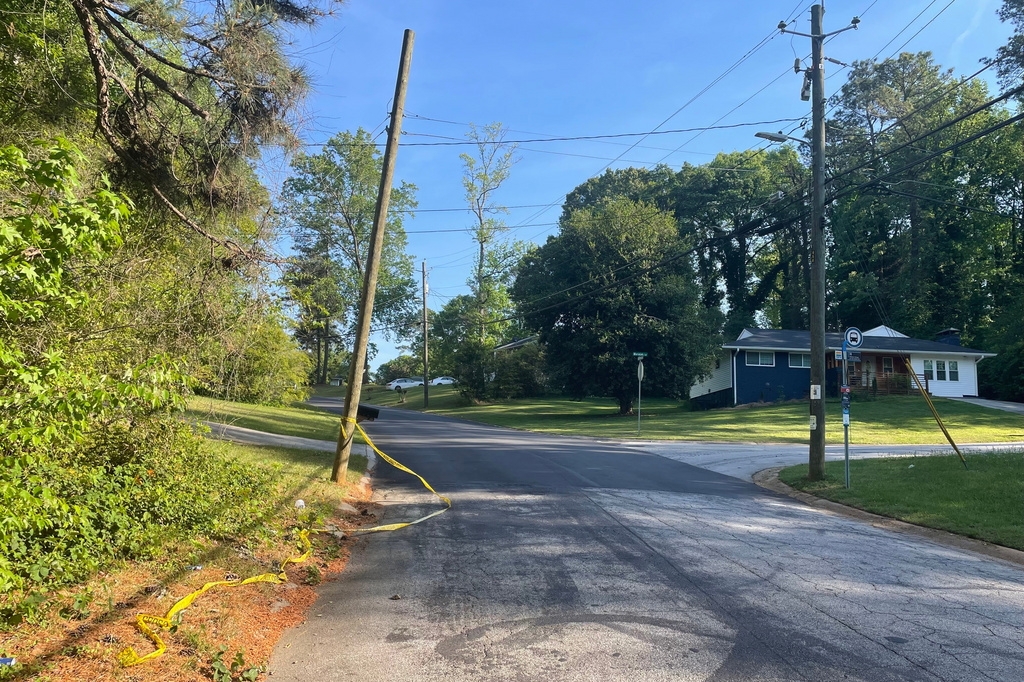 Crime scene tape is tied around a pole near the site where Lauren Bullis was killed, in Panthersville, Ga., Wednesday, April 15, 2026. (AP Photo/R.J. Rico)
