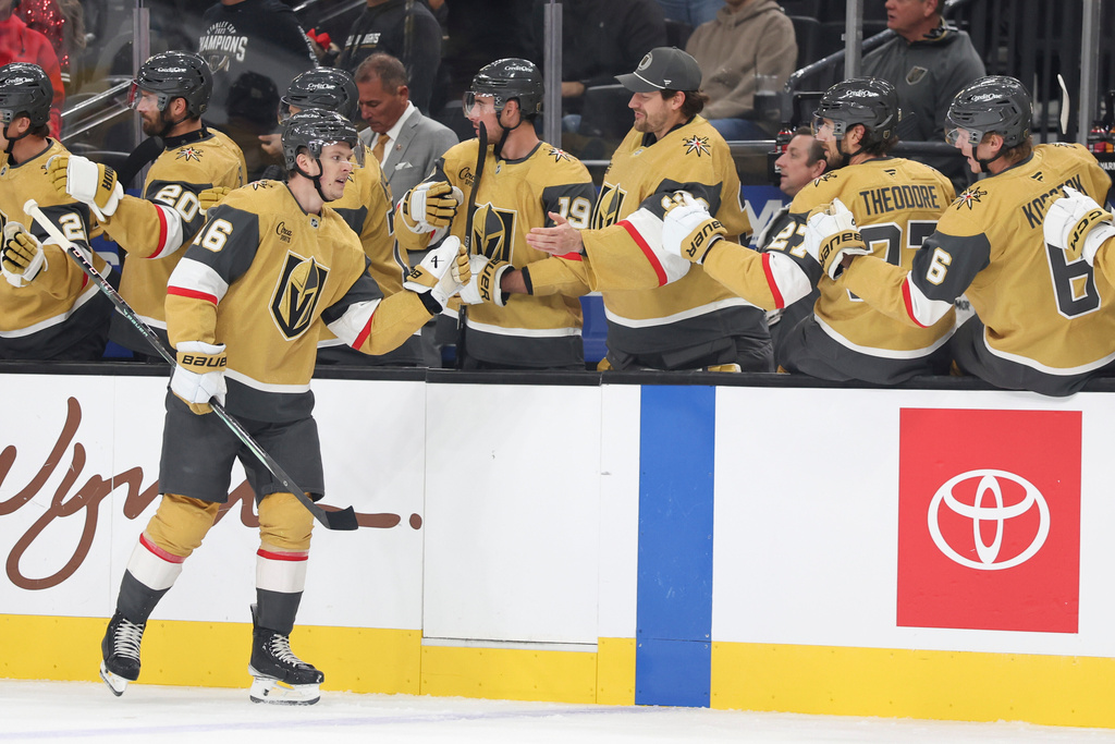 Vegas Golden Knights right wing Pavel Dorofeyev (16) celebrates with teammates after his goal against the Boston Bruins during the first period of an NHL hockey game Thursday, Oct. 16, 2025, in Las Vegas. (AP Photo/Ian Maule)