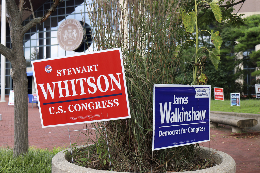 Campaign signs for the special election in Virginia's 11th Congressional District are on display outside the Fairfax County Government Center in Fairfax, Va., Aug. 15, 2025. (AP Photo/Robert Yoon)