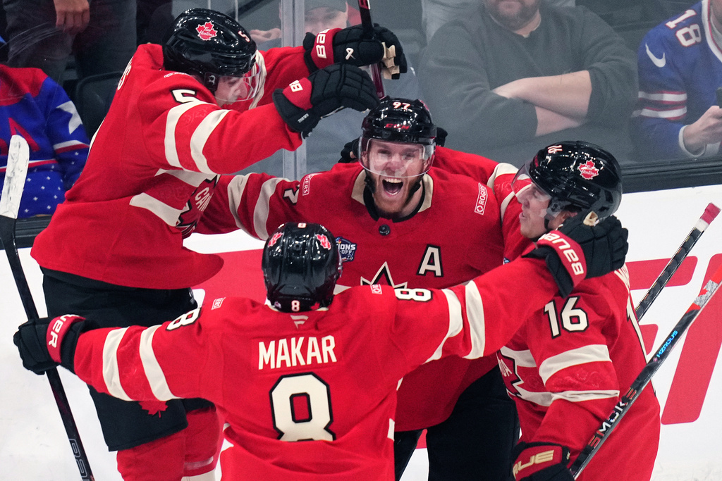 FILE - Canada's Connor McDavid (97) celebrates after his game-winning goal against the United States during an overtime period of the 4 Nations Face-Off championship hockey game, Feb. 20, 2025, in Boston. (AP Photo/Charles Krupa, File)