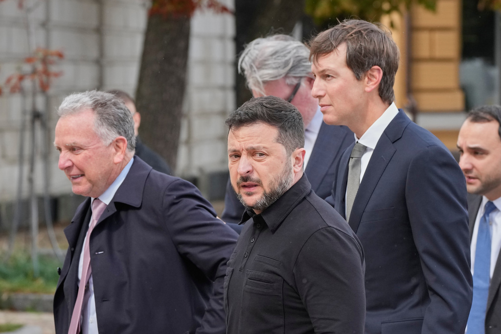 Ukraine's President Volodymyr Zelenskyy, center, and U.S. President Donald Trump's envoys Jared Kushner, right, and Steve Witkoff, left, walk prior to their talks in Kyiv, Ukraine, Sunday, Sept. 6, 2026. (AP Photo/Efrem Lukatsky)