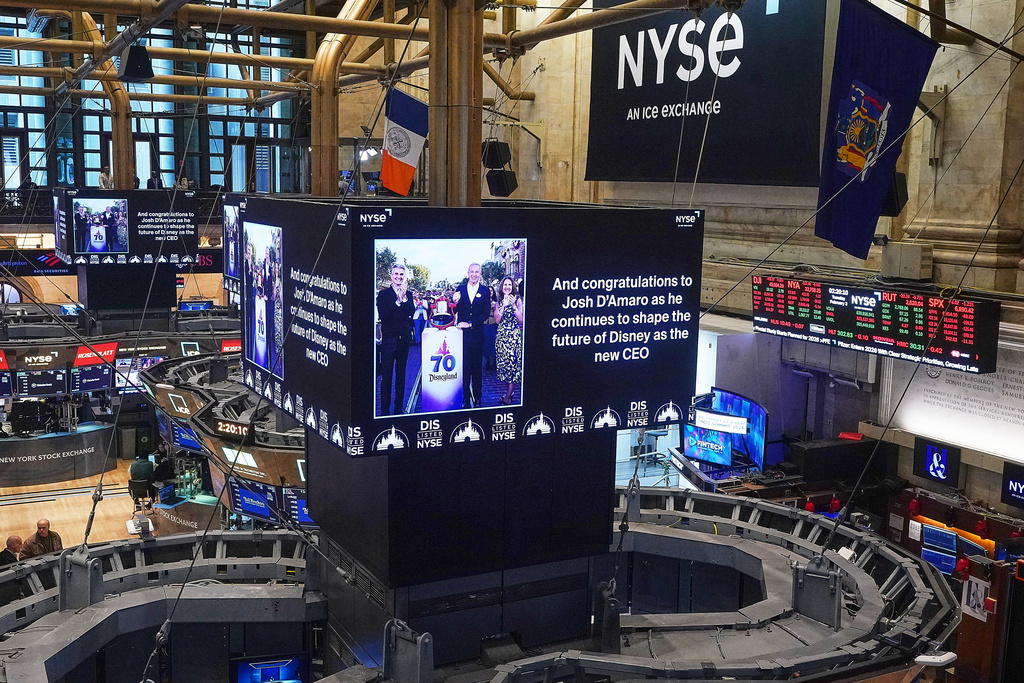 Video screens above trading posts the floor of the New York Stock Exchange display a congratulatory message to Disney parks chief Josh D'Amaro named as its next CEO, succeeding Bob Iger, Tuesday, Feb. 3, 2026. (AP Photo/Richard Drew)
