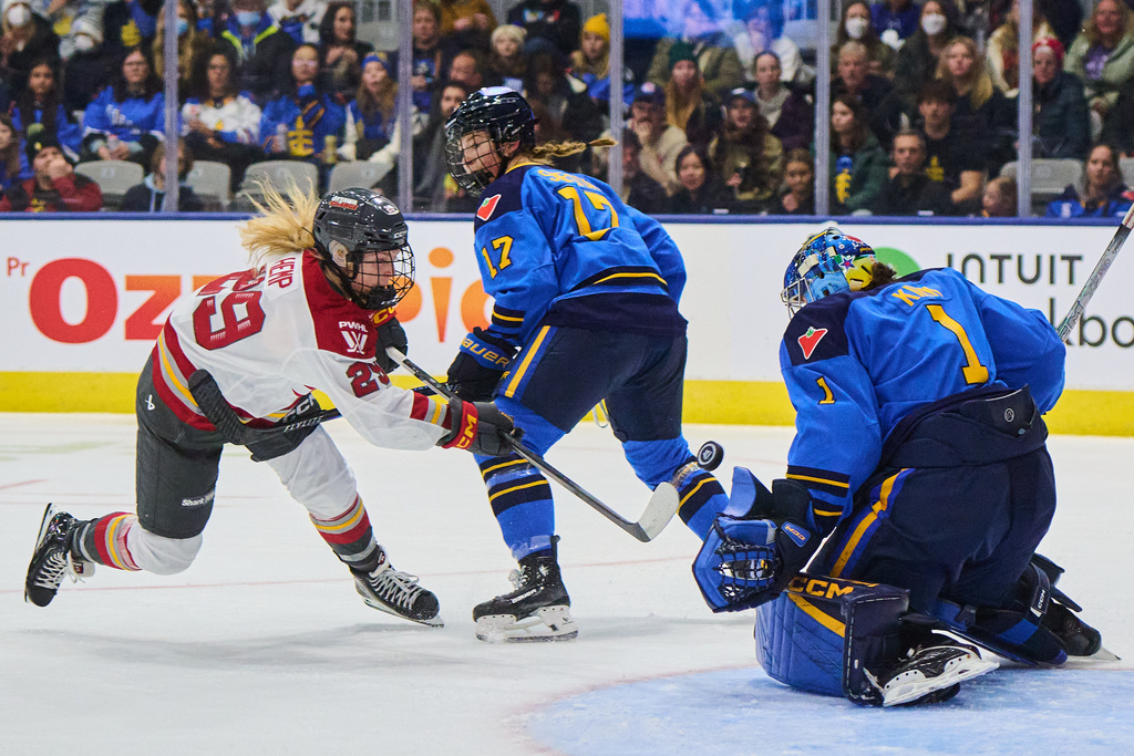 Ottawa Charge's Peyton Hemp (29) is stopped by Toronto Sceptres goaltender Raygan Kirk (1) as Ella Shelton (17) defends during the first period of a PWHL hockey game, in Toronto, Tuesday, Dec. 23, 2025. (Sammy Kogan/The Canadian Press via AP)