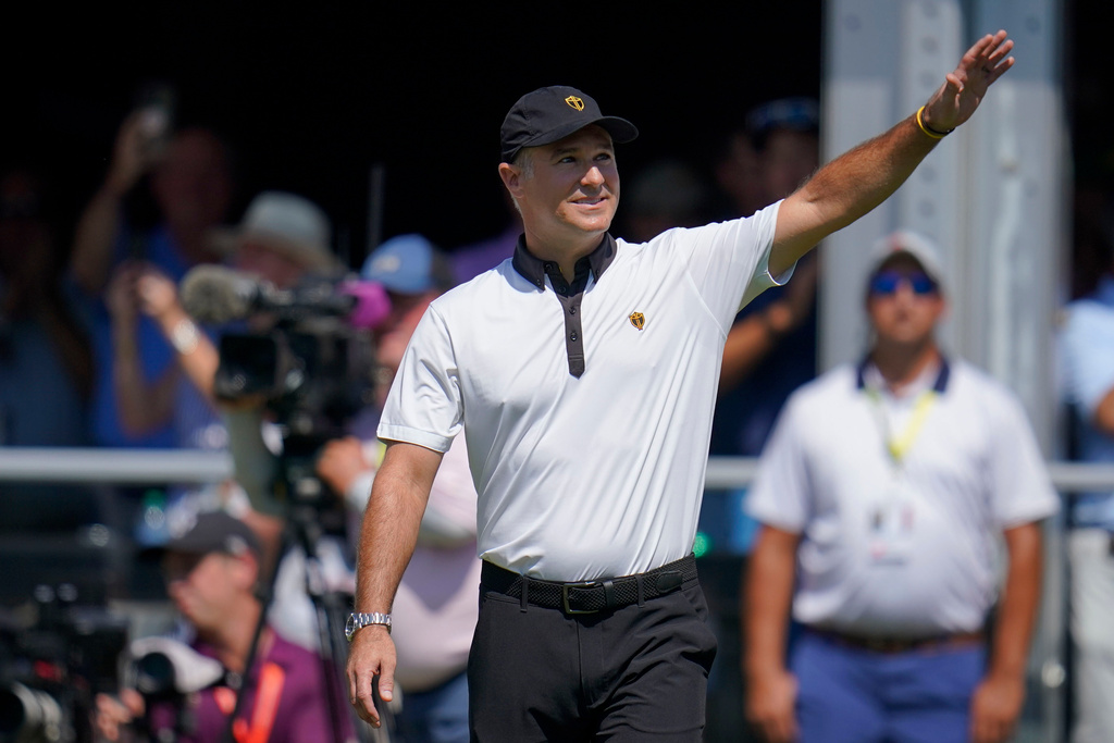 FILE - International team captain Trevor Immelman waves toward the gallery before a foursomes match at the Presidents Cup golf tournament at the Quail Hollow Club, Sept. 22, 2022, in Charlotte, N.C. (AP Photo/Julio Cortez, File)