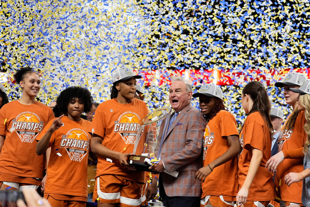 Texas celebrates after their win against South Carolina in an NCAA college basketball game in the final of the Southeastern Conference tournament, Sunday, March 8, 2026, in Greenville, S.C. (AP Photo/Chris Carlson)