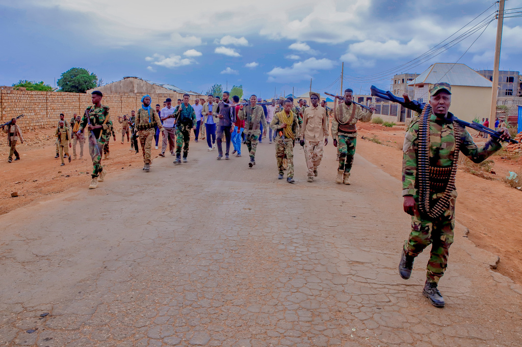 Government troops patrol alongside government officials after clashes with militias that killed dozens of people, including civilians, in Baidoa, Somalia, Monday, Aug. 17, 2026. (AP Photo)