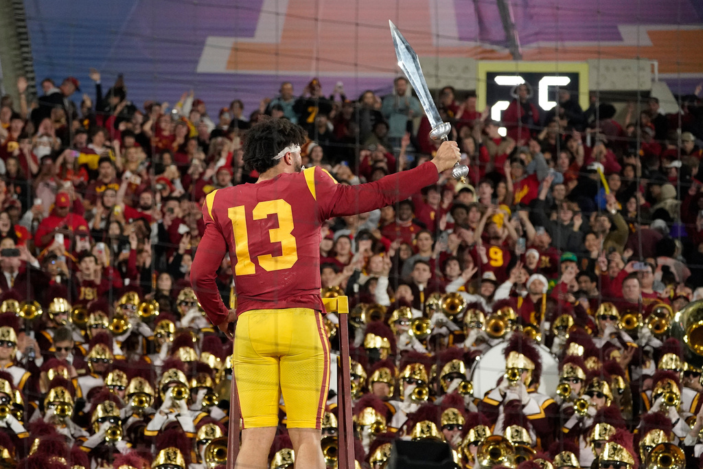 FILE - Southern California quarterback Caleb Williams leads the USC Marching Band after USC defeat UCLA 48-45 in an NCAA college football game Saturday, Nov. 19, 2022, in Pasadena, Calif. (AP Photo/Mark J. Terrill, File)