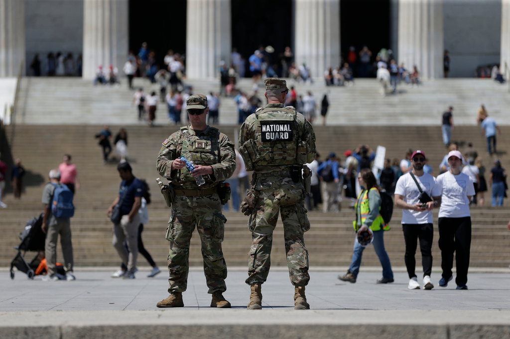 National Guard members patrol in front of the Lincoln Memorial, Friday, May 8, 2026, in Washington. (AP Photo/Rahmat Gul)