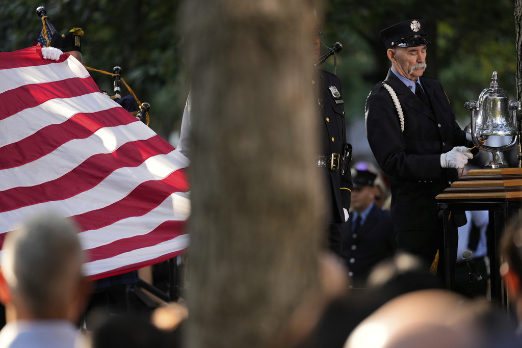 A firefighter rings a bell during a ceremony to mark the 24th anniversary of the 9/11 attacks, Thursday, Sept. 11, 2025, in New York. (AP Photo/Seth Wenig)