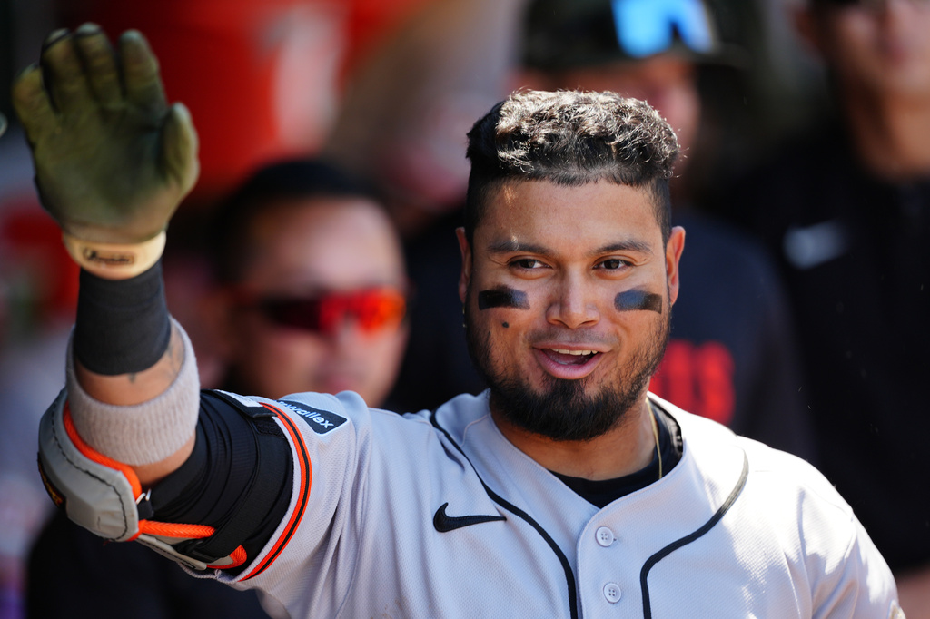 San Francisco Giants' Luis Arraez is greeted in the dugout after his home run in the third inning of a baseball game against the Athletics, Sunday, May 17, 2026, in West Sacramento, Calif. (AP Photo/Alan Greth)