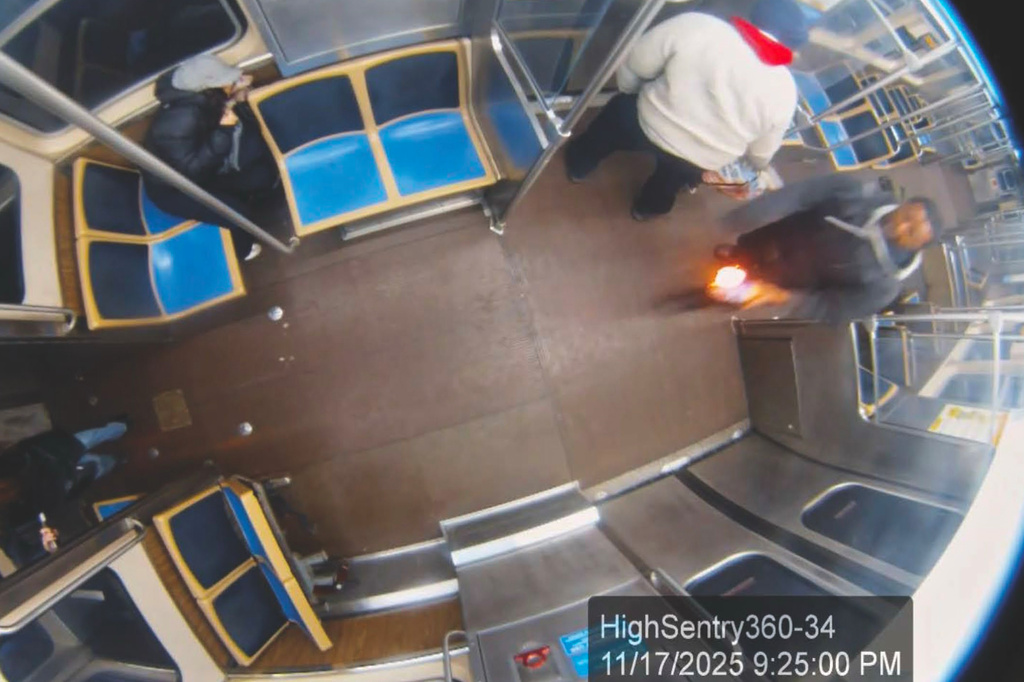 This still image taken from Chicago Transit Authority surveillance footage and included in a federal court record shows a man who federal authorities identified as Lawrence Reed holding a flaming bottle and approaching a passenger, far left, on Monday, Nov. 17, 2025, on a Chicago Blue Line train. (Chicago Transit Authority/U.S. District Court Northern District of Illinois via AP)