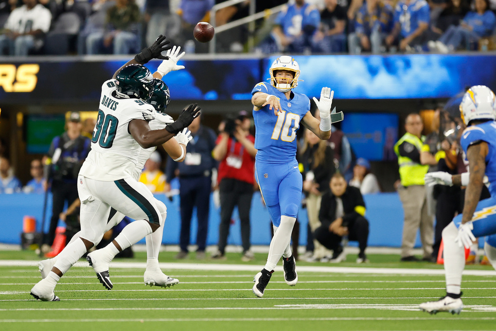 Los Angeles Chargers quarterback Justin Herbert (10) throws a pass during the first half of an NFL football game against the Philadelphia Eagles, Monday, Dec. 8, 2025, in Inglewood, Calif. (AP Photo/Caroline Brehman)