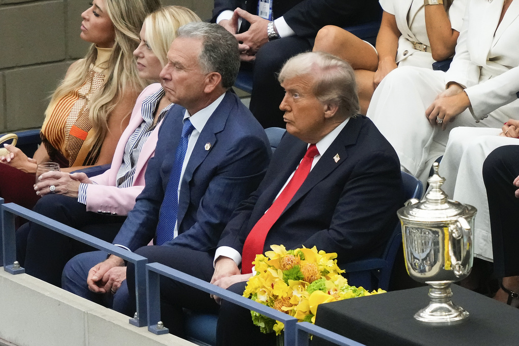 President Donald Trump, right, Steve Witkoff, center, and U.S. Attorney General, Pam Bondi, watch play between Carlos Alcaraz, of Spain, and Jannik Sinner, of Italy, during the men's singles final of the U.S. Open tennis championships, Sunday, Sept. 7, 2025, in New York. (AP Photo/Yuki Iwamura)