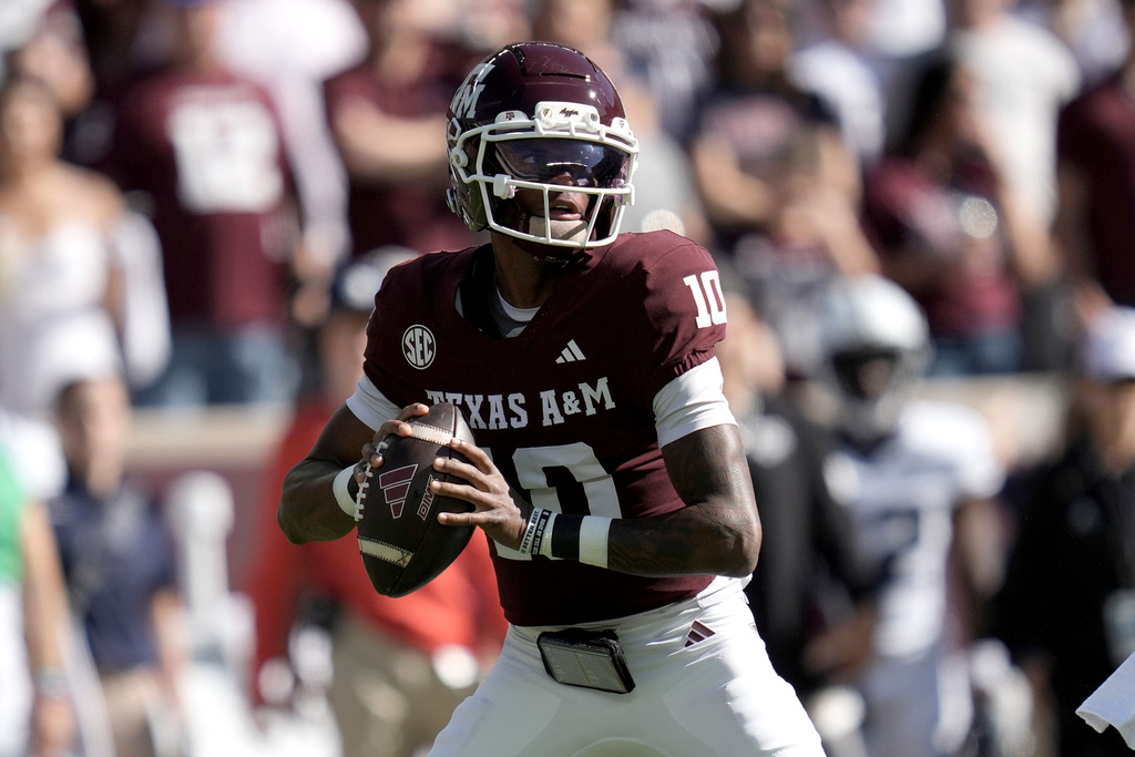 Texas A&M quarterback Marcel Reed (10) looks to pass downfield against Samford during the first quarter of an NCAA college football game Saturday, Nov. 22, 2025, in College Station, Texas. (AP Photo/Sam Craft)