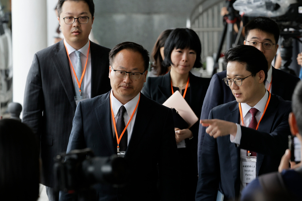 Jenkin Suen, counsel for the Hong Kong government leaves for a lunch break following the closing submissions at the hearing of an independent committee investigating last year's Tai Po fire, in Hong Kong, Friday, July 17, 2026. (AP Photo/May James)