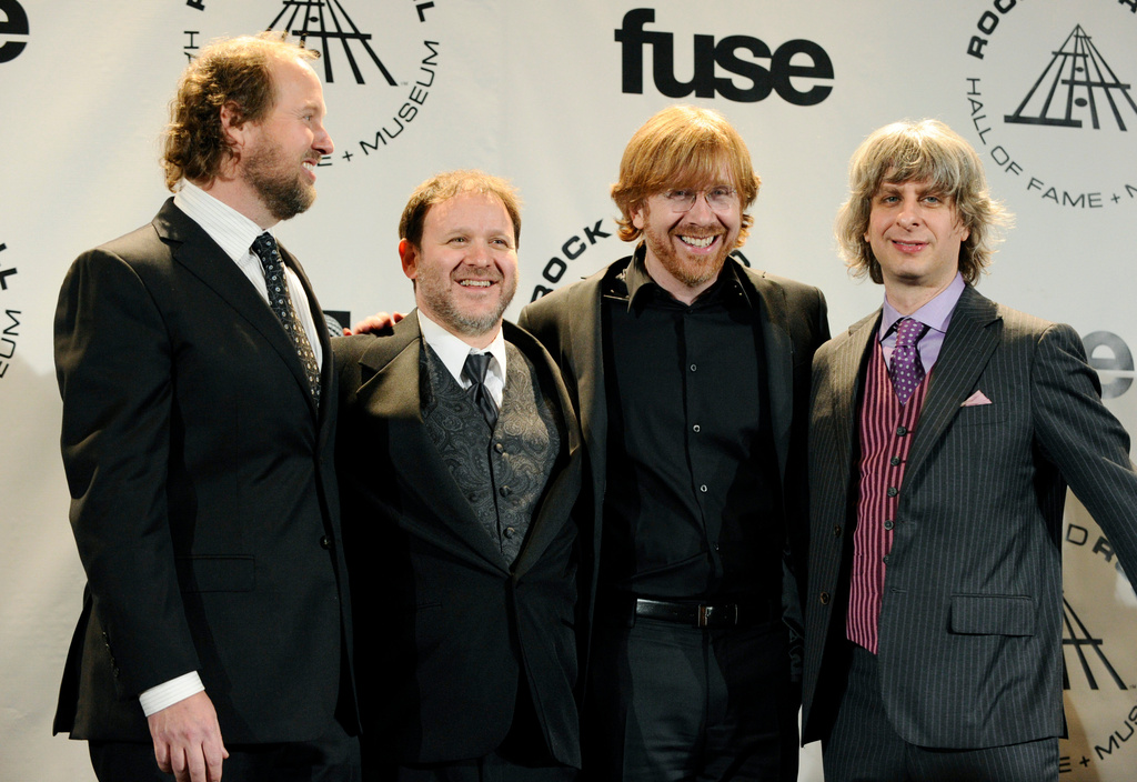 FILE - From left to right, members of the band Phish, Page McConnell, Jon Fishman, Trey Anastasio and Mike Gordon appear in the press room after performing at the Rock and Roll Hall of Fame induction ceremony, Monday, March 15, 2010 in New York. (AP Photo/Peter Kramer, File)