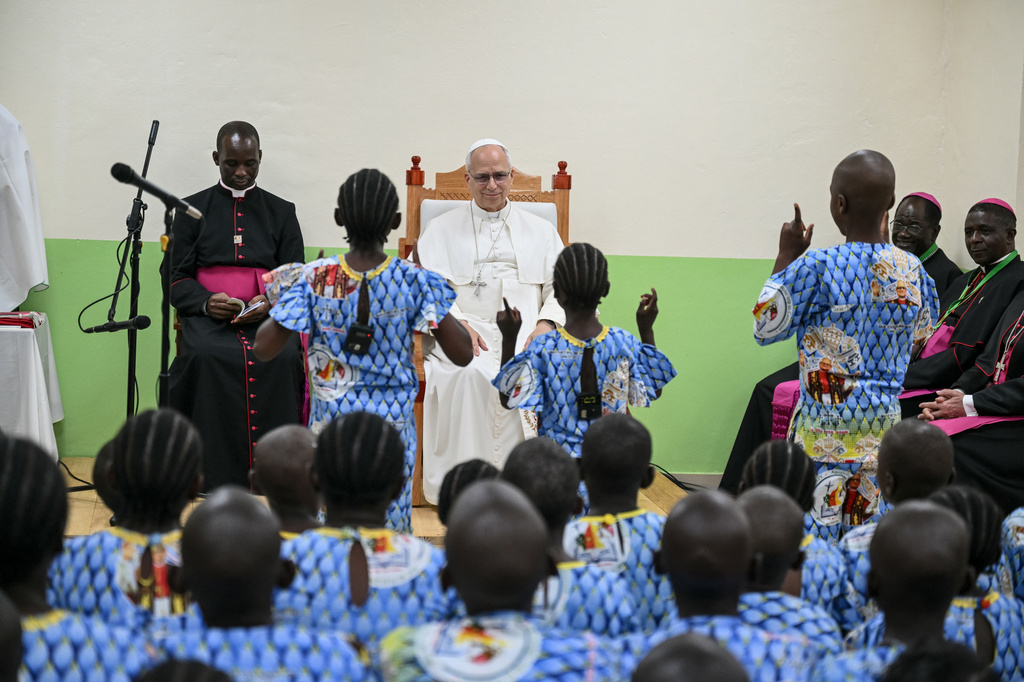 Pope Leo XIV watches children perform a dance as he visits the Ngul Zamba (Power of God) orphanage in Yaounde, Cameroon, Wednesday April 15, 2026 on the third day of his apostolic journey to Africa. (Alberto Pizzoli, Pool Photo via AP)
