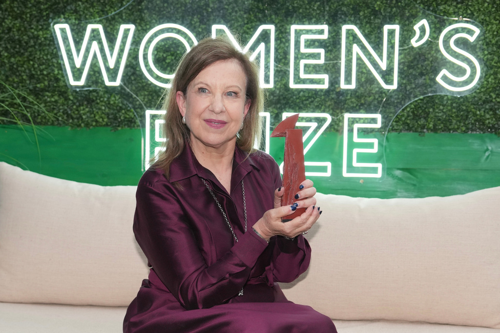 Lyse Doucet, winner of The Women's Prize for nonfiction, poses for a photograph at the Women's Prize Trust Summer Party & Awards Ceremony for the 2026, in London, Thursday, June 11, 2026. (AP Photo/Kin Cheung)