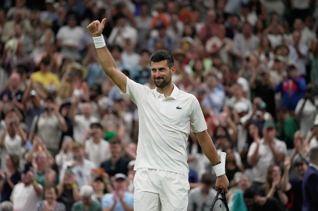 Novak Djokovic of Serbia celebrates his victory against Stefanos Tsitsipas of Greece in their second round men's singles match at the Wimbledon Tennis Championships in London, Wednesday, July 1, 2026. (AP Photo/Brian Inganga)
