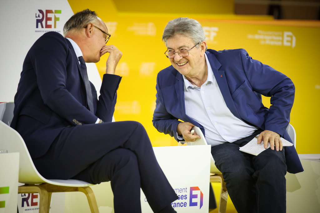 FILE - Former French Prime Minister and head of Horizons political party Edouard Philippe and French far-left leader Jean-Luc Melenchon, right, candidates at presidential election attend the business meeting organized by the French business organization (MEDEF) in Paris, Thursday, Aug. 27, 2026. (AP Photo/Thomas Padilla, File)