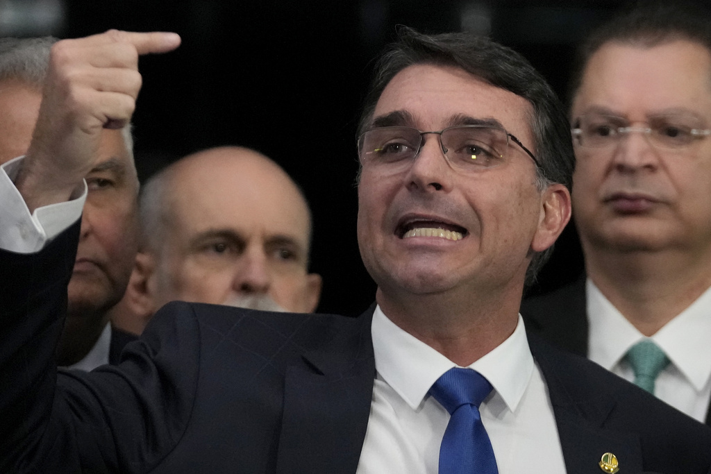 Senator Flavio Bolsonaro, the son of former President Jair Bolsonaro, speaks during a press conference about his father's trial, in Brasilia, Brazil, Tuesday, Sept. 9, 2025. (AP Photo/Eraldo Peres)